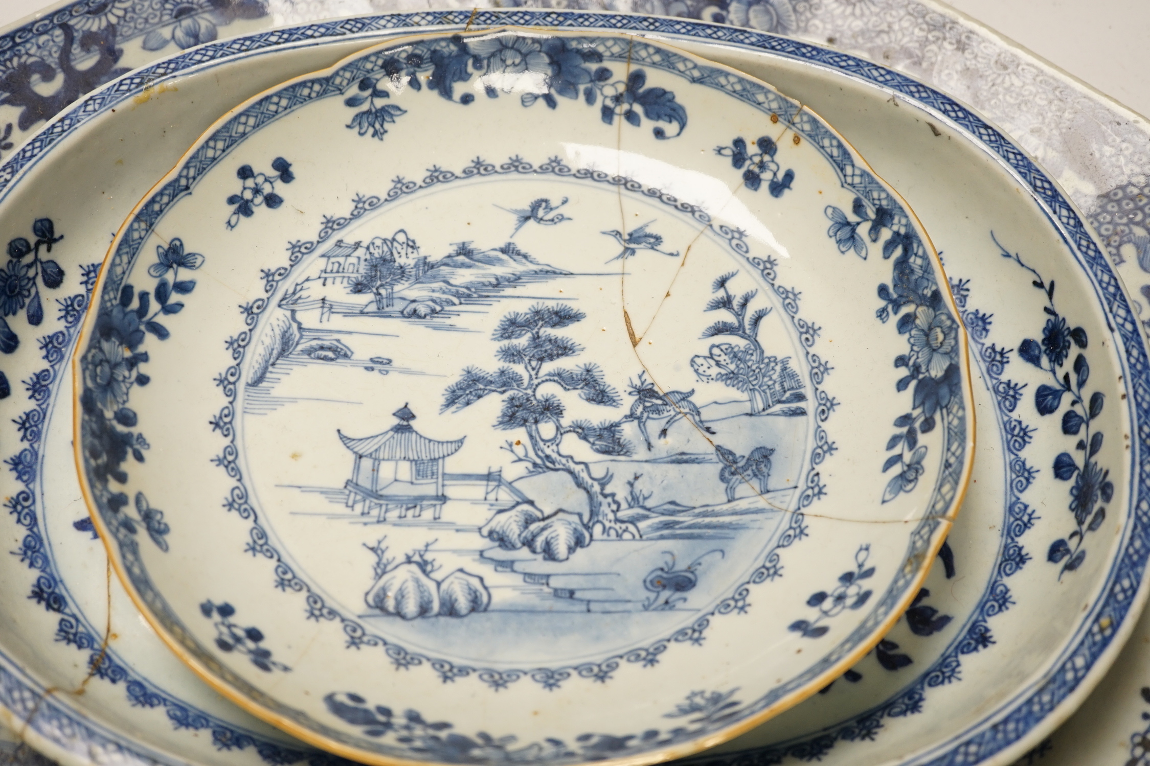 Three 18th century Chinese blue and white export dishes, largest 46x39cm